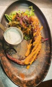 OCTOPUS marinated & grilled with pickled cucumber salad in mojo canario dressing and served with aioli (GF, DF opt)
